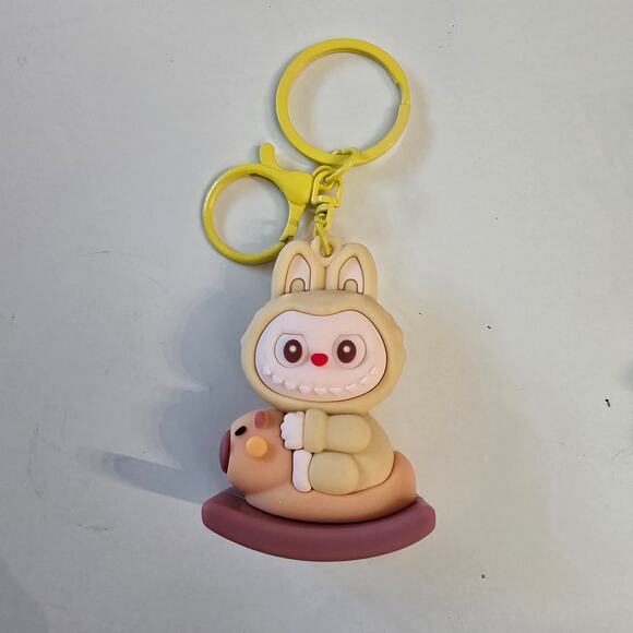 Little Monster on a Capybara yellow keychain - Picture 1 of 4